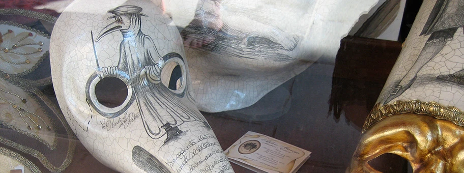 Medico Della Peste - «plague doctor's» mask - Beak doctor mask; Traditional Venetian Carnavale masks, including the «plague doctor's» mask, in the window of the Ca' del Sol mask shop in the Sestiere di Castello.