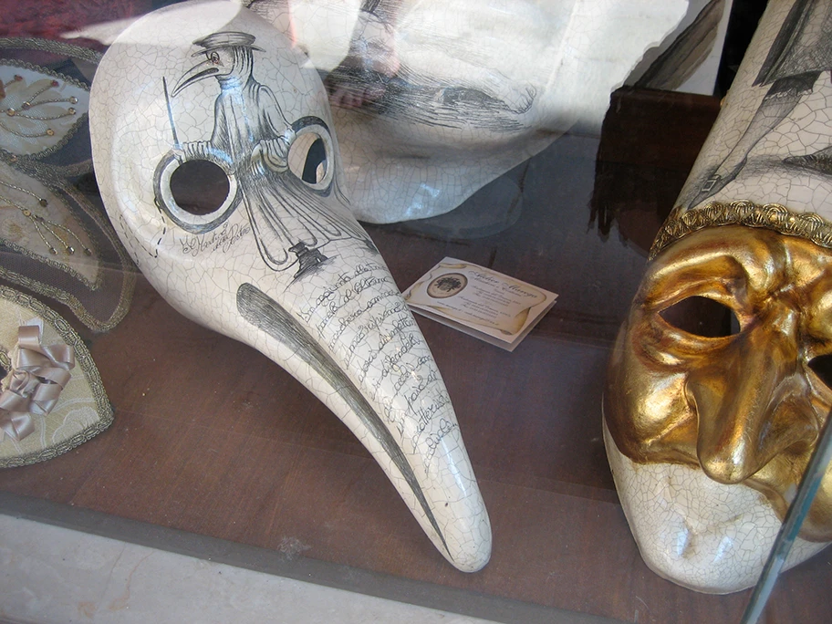 Medico Della Peste - «plague doctor's» mask - Beak doctor mask; Traditional Venetian Carnavale masks, including the «plague doctor's» mask, in the window of the Ca' del Sol mask shop in the Sestiere di Castello.