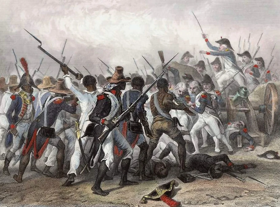 Haiti 1802. Truppen von Napoleon kämpfen gegen aufständische Sklaven während der Haitianischen Revolution. Die französischen BürgerInnen in Paris wollen konsumieren. Und die ökonomische Grundlage ist die Akkumulation, die Anhäufung von Reichtum. Diese beruht direkt auf der Sklaverei.